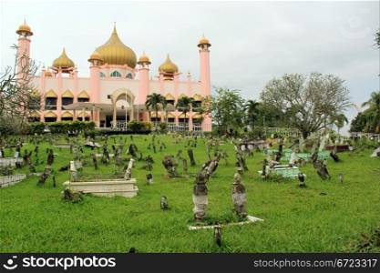 Mosque and graveyard in Kuching, Sarawak, Borneo, Malaysia
