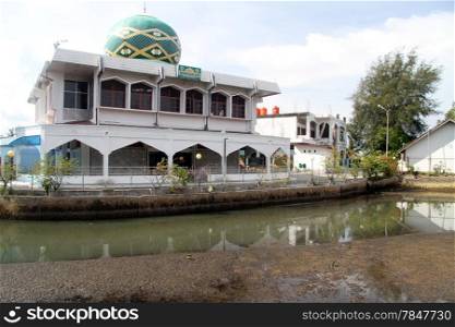 Mosque near channel in Padang, Indonesia