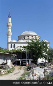 Mosque with high minarets in turkish village in Turkey