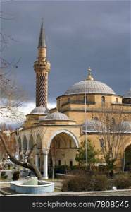 Mosque with minaret and dark clouds in Afyon, Turkey