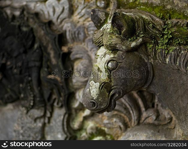 Moss covered sculpture in Bali