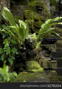 Moss covered statue in Bali