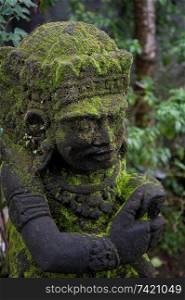 Moss on a statue in Bali