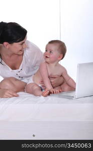 Mother and baby daughter at home