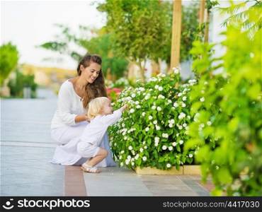 Mother and baby discover vegetable life outdoors