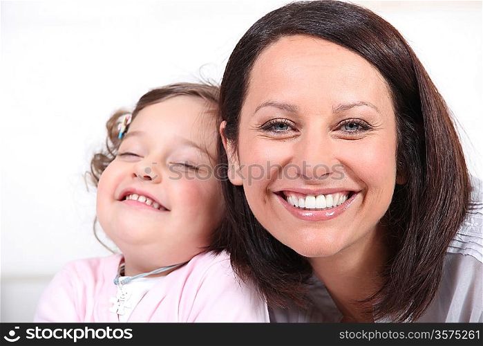Mother and baby laughing