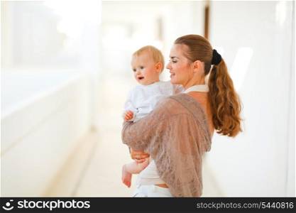 Mother and baby looking on copy-space