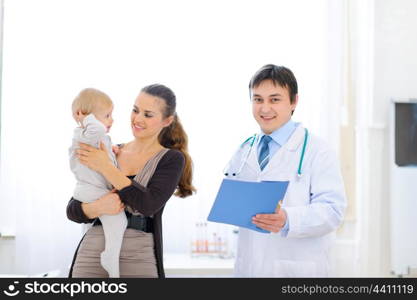 Mother and baby on examination at pediatricians cabinet&#xA;