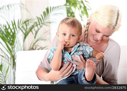 Mother and baby sitting on a sofa
