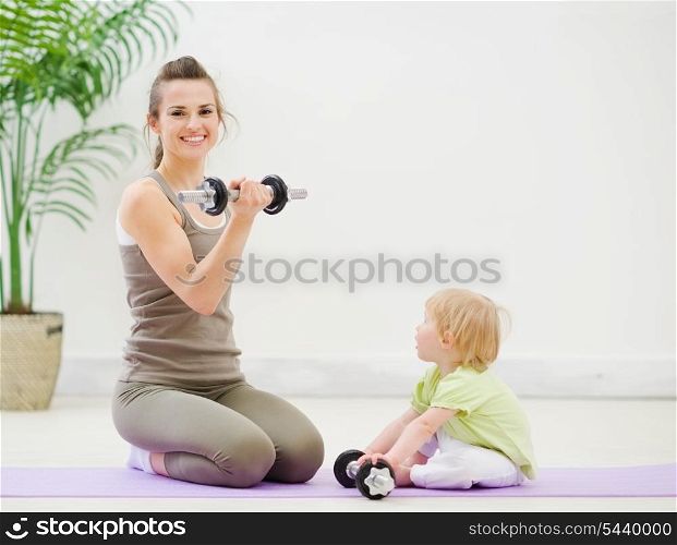 Mother and baby spending time doing fitness