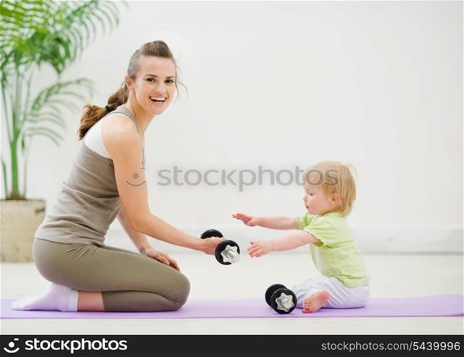 Mother and baby spending time in gym