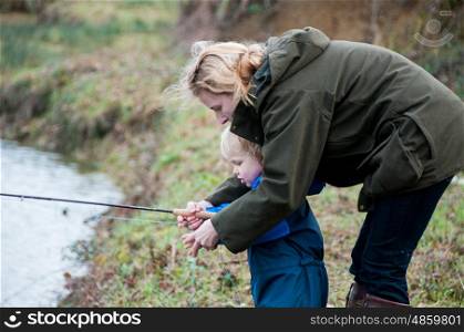 Mother and child fishing together