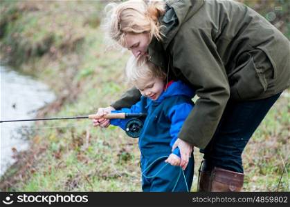 Mother and child fishing together