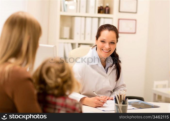 Mother and child girl visit pediatrician office healthcare specialist