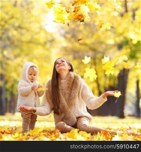Mother and child in autumn park