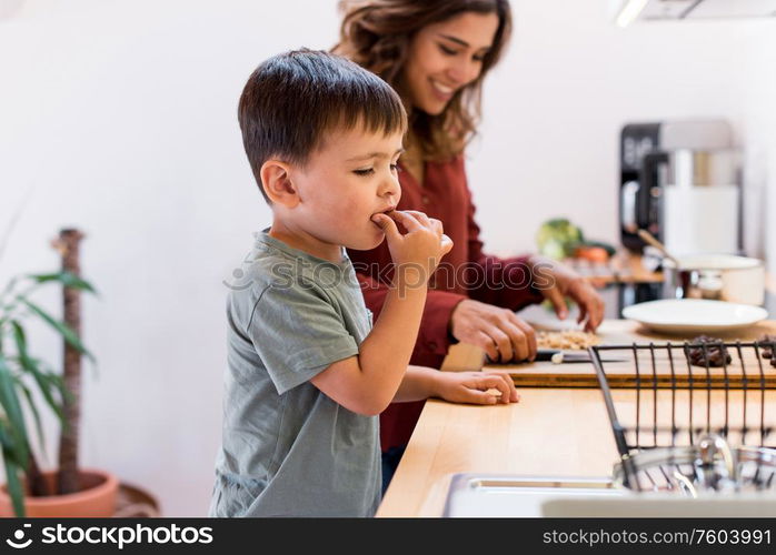 Mother and child making chocolate peanut cookies for quarantine - Stay at home