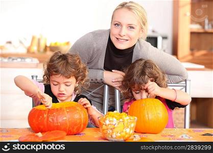 Mother and child preparing pumpkin