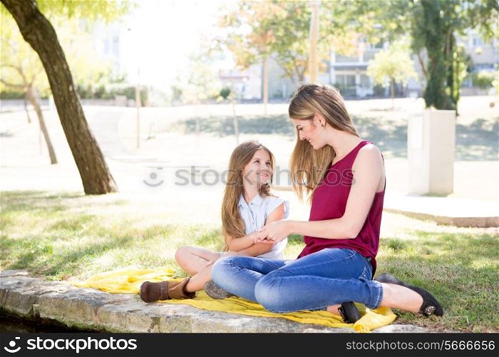 Mother and child relaxing in the city park