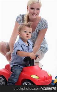 Mother and Child riding toy car