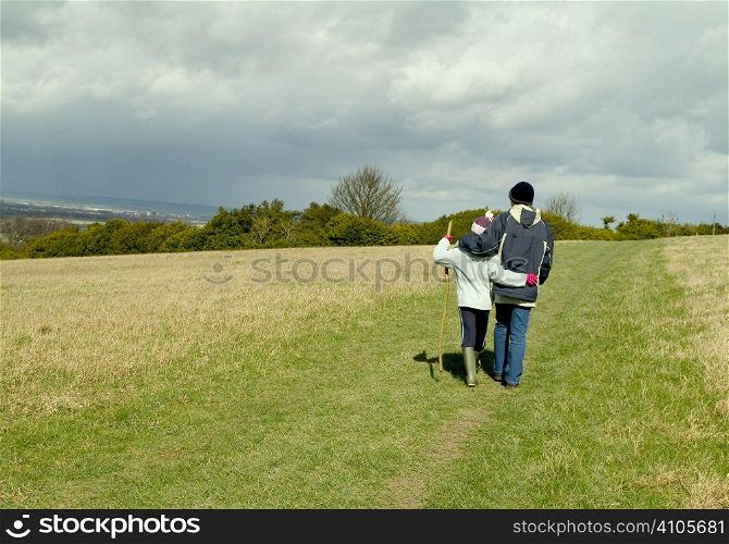 mother and child walking in the country side