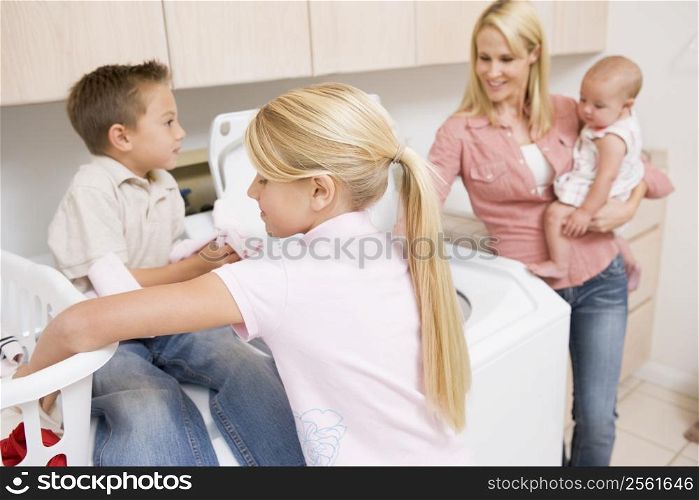 Mother And Children Doing Laundry
