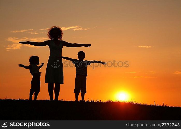 Mother and children on sunset sport training