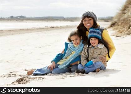 Mother And Children On Winter Beach