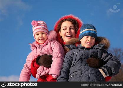 mother and children outdoor in winter
