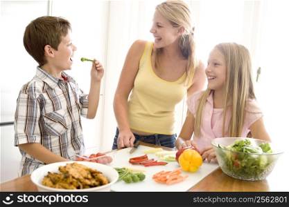 Mother And Children Prepare A meal,mealtime Together