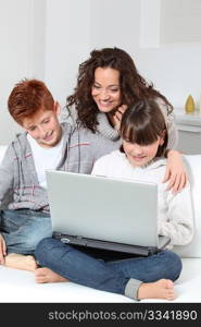 Mother and children surfing on internet