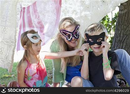 Mother and children wearing masks