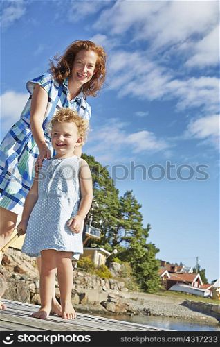 Mother and daughter at coast, Utvalnas, Gavle, Sweden