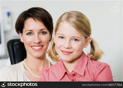 Mother and daughter at dentists office