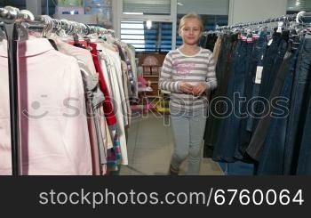 Mother and daughter choosing clothes in a clothing store