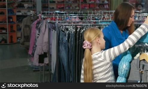 Mother and daughter choosing clothes in a clothing store