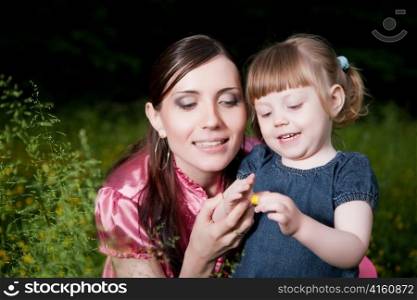 Mother And Daughter Close-Up Portrait Outdoors