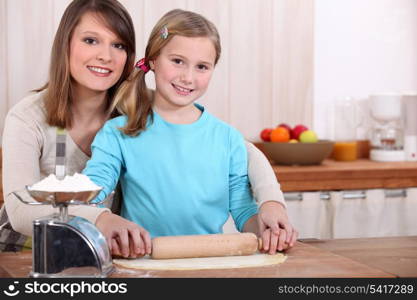 Mother and daughter cooking