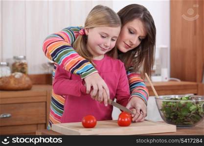 mother and daughter cooking together