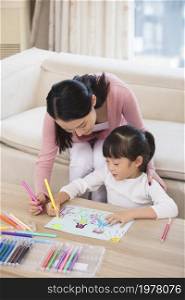 Mother and daughter drawing pictures together