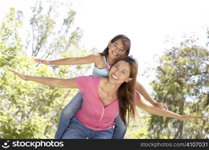 Mother And Daughter Enjoying Day In Park