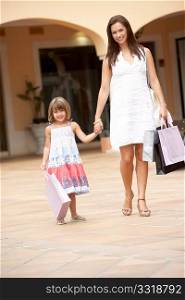 Mother And Daughter Enjoying Shopping Trip Together