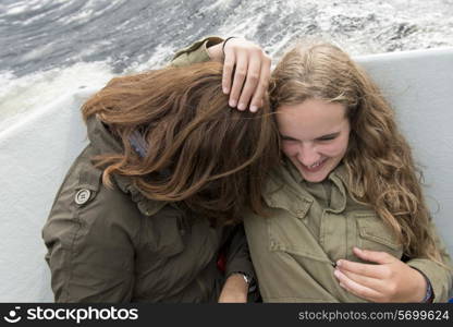 Mother and daughter enjoying Western Brook Pond fjord boat tour, Gros Morne National Park, Newfoundland and Labrador, Canada