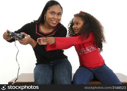 Mother and daughter fighting over game controller.