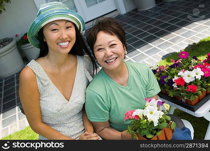 Mother and Daughter Gardening Together