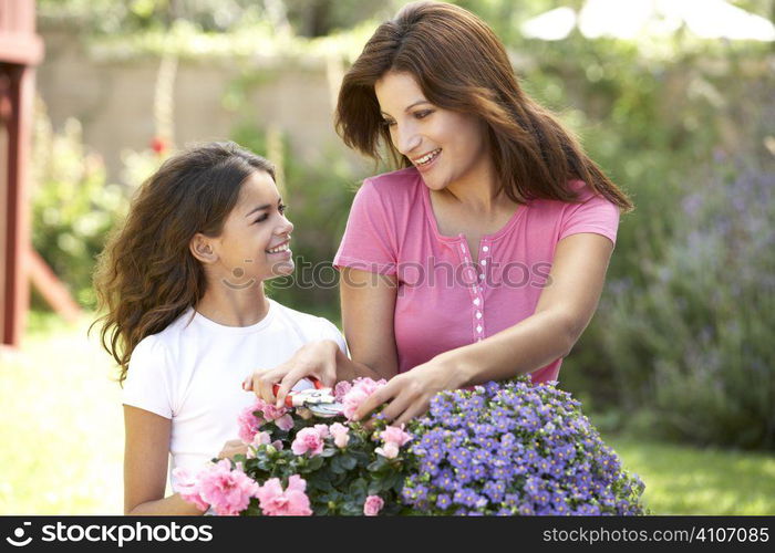 Mother And Daughter Gardening Together