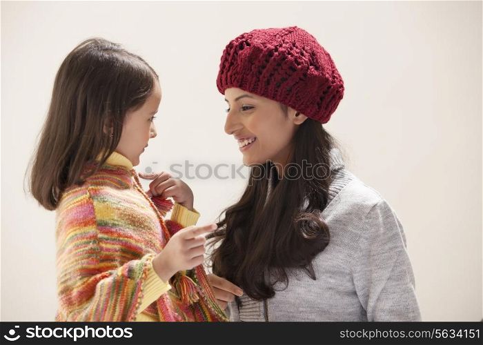 Mother and daughter gesturing