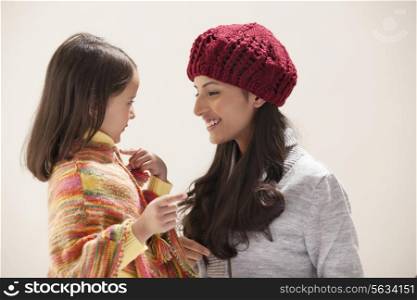Mother and daughter gesturing