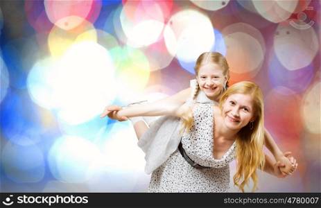 Mother and daughter. Happy family of smiling mother and daughter