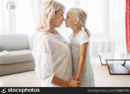 Mother and daughter have a good holidays at home. Parent feeling, togetherness, happy family