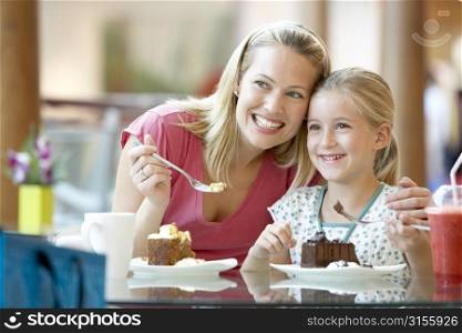 Mother And Daughter Having Lunch Together At The Mall